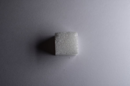 Sugar cubes white background background iluminated sweet food. High quality photo
