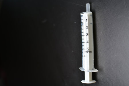 Injection Syringe medicine needle background black. High quality photoの写真素材