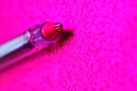 ball point pen closeup background cork paper pink light. High quality photoの写真素材