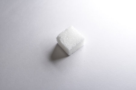 Sugar cubes white background background iluminated sweet food. High quality photoの写真素材