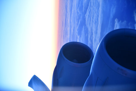 View of sunset from Airplane Window jet engine wing colorful. High quality photo