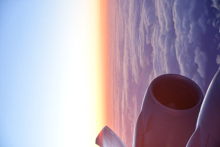 View of sunset from Airplane Window jet engine wing colorful. High quality photo