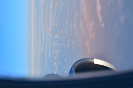 view of Norway from Jet Plain Window in Winter with Window Jet Engine wing High quality photo