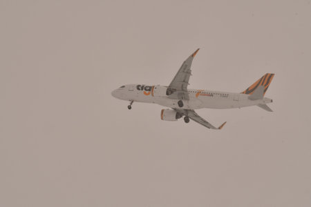 Airplane in clouds during snow bad weather Hokkaido Japan. High quality photo