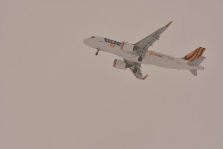Airplane in clouds during snow bad weather Hokkaido Japan. High quality photo