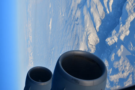 view of Norway from Jet Plain Window in Winter with Window Jet Engine wing High quality photo
