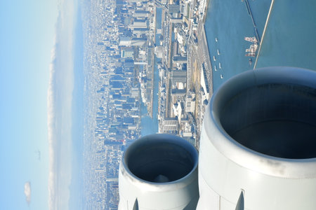 Tokyo Area from Airplane Window Jet Engine Wing. High quality photo