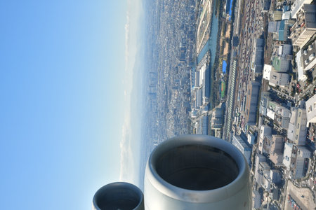 Tokyo Area from Airplane Window Jet Engine Wing. High quality photo