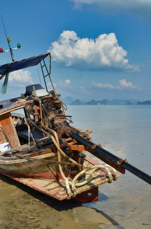 long tail boat on coast of thailand asia sunset. High quality photoの写真素材