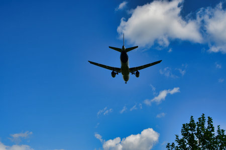 jet landing at Frankfurt Airport blue sky clouds. High quality photo