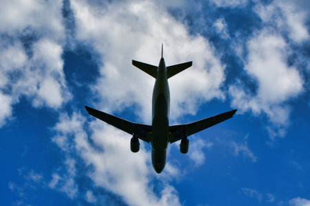 jet landing at Frankfurt Airport blue sky clouds. High quality photo