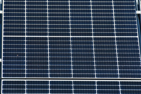 photovoltaic power electricity energy renewable sun green background. High quality photo