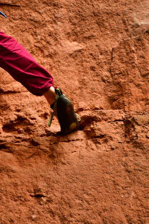 Climbing foot of young woman on real rock. High quality photoの写真素材