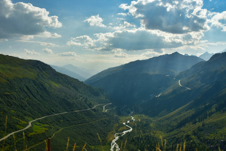 Alpine Road Grimsel Pass Switzerland Alps curves europe Furkapass mountain scenery. High quality...