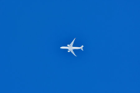 Jet on Blue Sky Background Airplane Aviation. High quality photoの写真素材