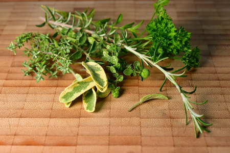 fresh herbs on cutting board Thyme rosemary sage oreganoの写真素材