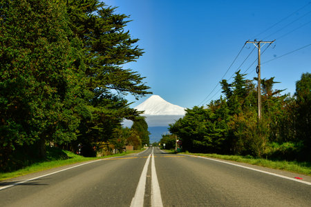 Osorno Vulcano with snow cap green meadows Chile. High quality photoの写真素材