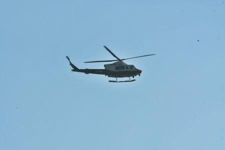 Helicopter in flight with cloud background sky. High quality photoの写真素材