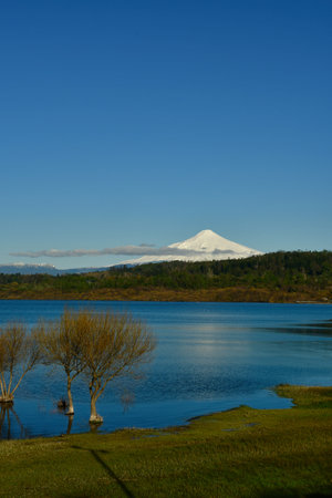 Villarrica volcano with lake blue sky sunset Chile. High quality photoの写真素材