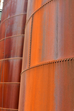 Steel surface rusty colorful red old classic rivet tank ship background. High quality photoの写真素材
