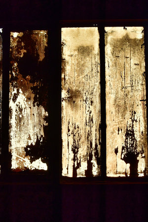 Dirty glass window in abdoned ironworks Germany Voelklingen background contrast. High quality photoの写真素材