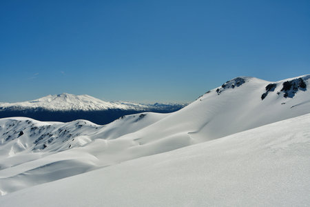 ski panorama top touring mountaineering patagonia volcano snow blue sky background. High quality photoの写真素材
