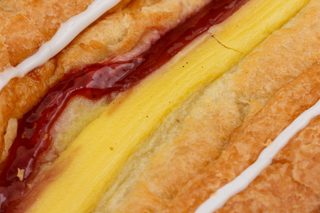 Close-up of a danish pastry showing custard and jamの写真素材