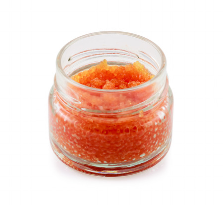Red caviar from a lumpsucker or lumpfish Cyclopterus lumpus in a glass jar isolated on whiteの写真素材