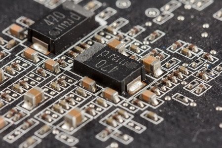 Close-up of a black printed circuit board PCB