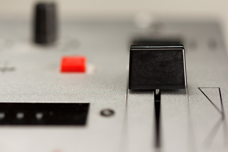 Cross fader of a DJ mixer with metal surfaceの写真素材