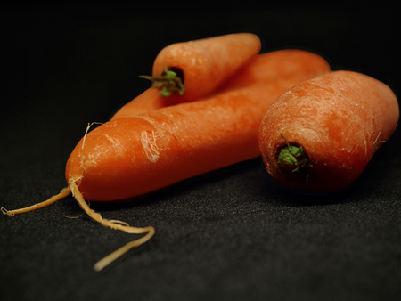 Carrots on a black backgroundの写真素材