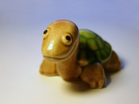 Porcelain smiling turtle figure.の写真素材