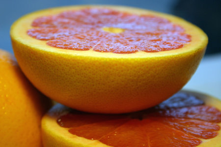 Sliced red grapefruits close-up.の写真素材