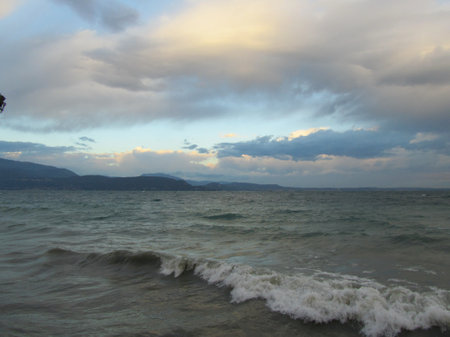 scenic view over the lago di garda with dramatic skyの写真素材
