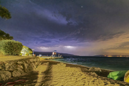 Night view of the sea and a lightning. Cres Island, Croatia