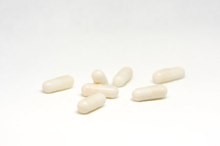 Capsules of Selenium isolated on white backgroundの写真素材