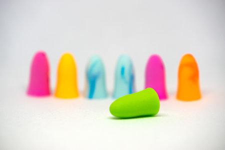 Set of colorful earplugs isolated on white background with space for copytext