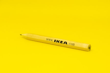 Pencil with the IKEA online shopping address isolated on orange backgroundのeditorial素材