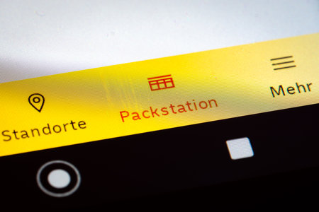 Logo of the DHL Packstation on an Android deviceのeditorial素材