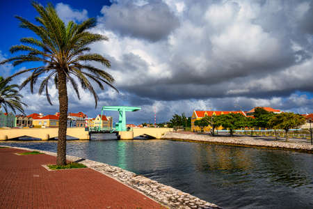 A view of a bridge in willemstad on curacao with blue sky and beautiful cloudsのeditorial素材