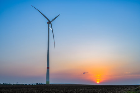 A view of a wind turbine at sunset in Allstedt in Saxony-Anhalt
