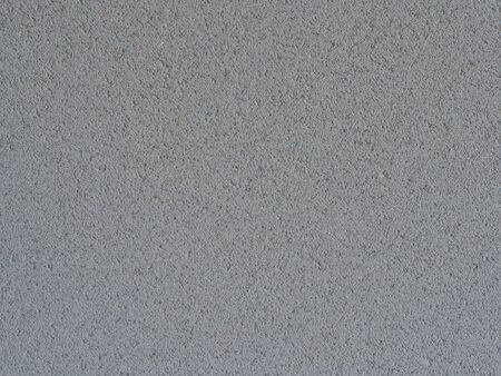 lime sandstone close up in the shadow as background textureの写真素材