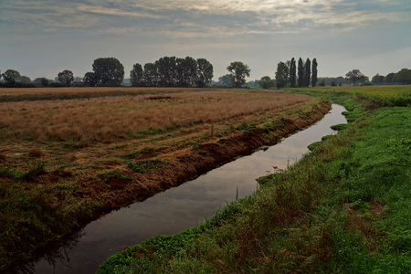 Lower rhine landscape on a cloudy summer morning, Germanyの写真素材