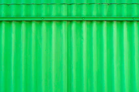 Background made of real corrugated metallic green colorの写真素材