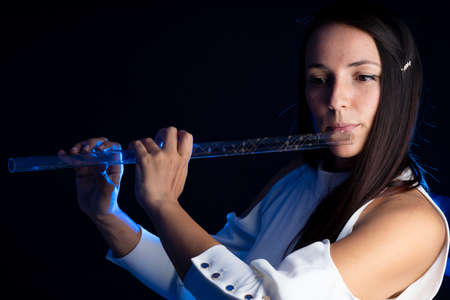 A beautiful girl that plays a crystal fluteの写真素材