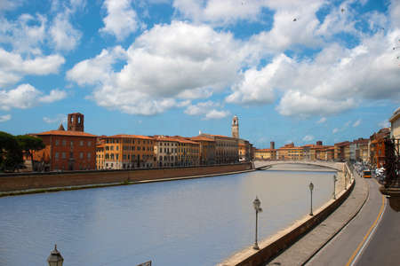 A view of the Arno River which runs through the city of Pisa Tuscany Italyの写真素材