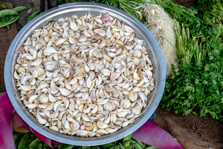 Clean garlic in a bucket at the marketの写真素材