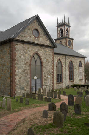 Old church road with graveyard with tombstonesの写真素材