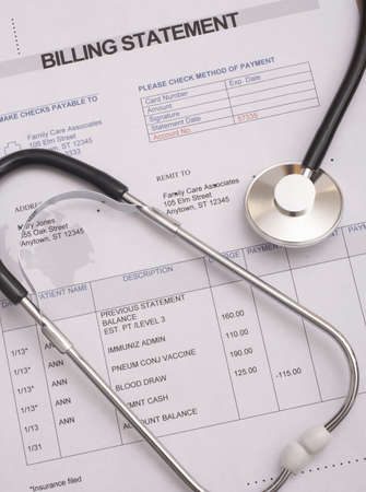 Stethoscope on medical billing statement all text is anonymousの写真素材
