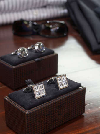 Display of men's diamond and silver cufflinksの写真素材